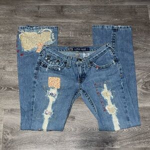 Cruel Girl Low-rise Slim distressed denim jeans with patches